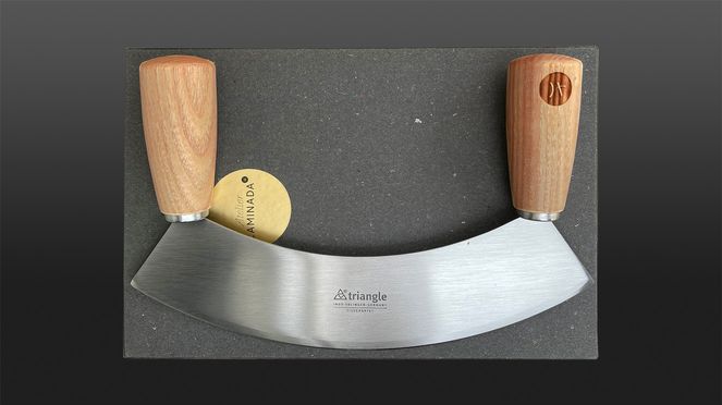 
                    Caminada mincing knife with logo of top chef Andreas Caminada