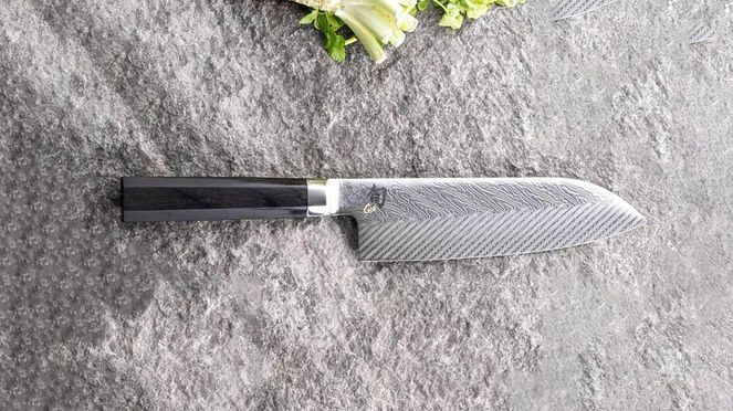 
                    Dual Core Santoku with artistically designed, radiating pattern of Damascus layers